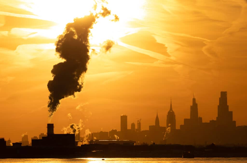 Smoke stack rising above the Manhattan skyline in New York City