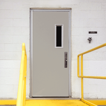 FRP-Pedestrian-Door FRP pedestrian door with a small vision panel o the exterior of a building