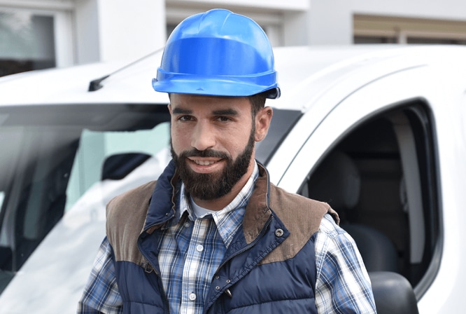 Man in a blue hard hat.