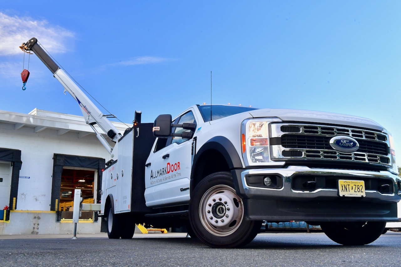 Allmark Door service truck in front of a landing dock